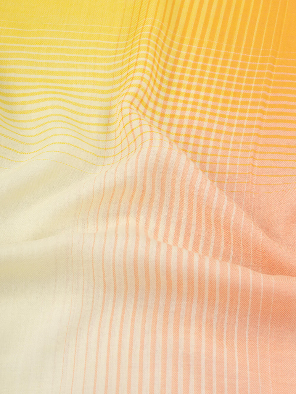 close up of a orange and yellow square cashmere scarf with a gradient check design