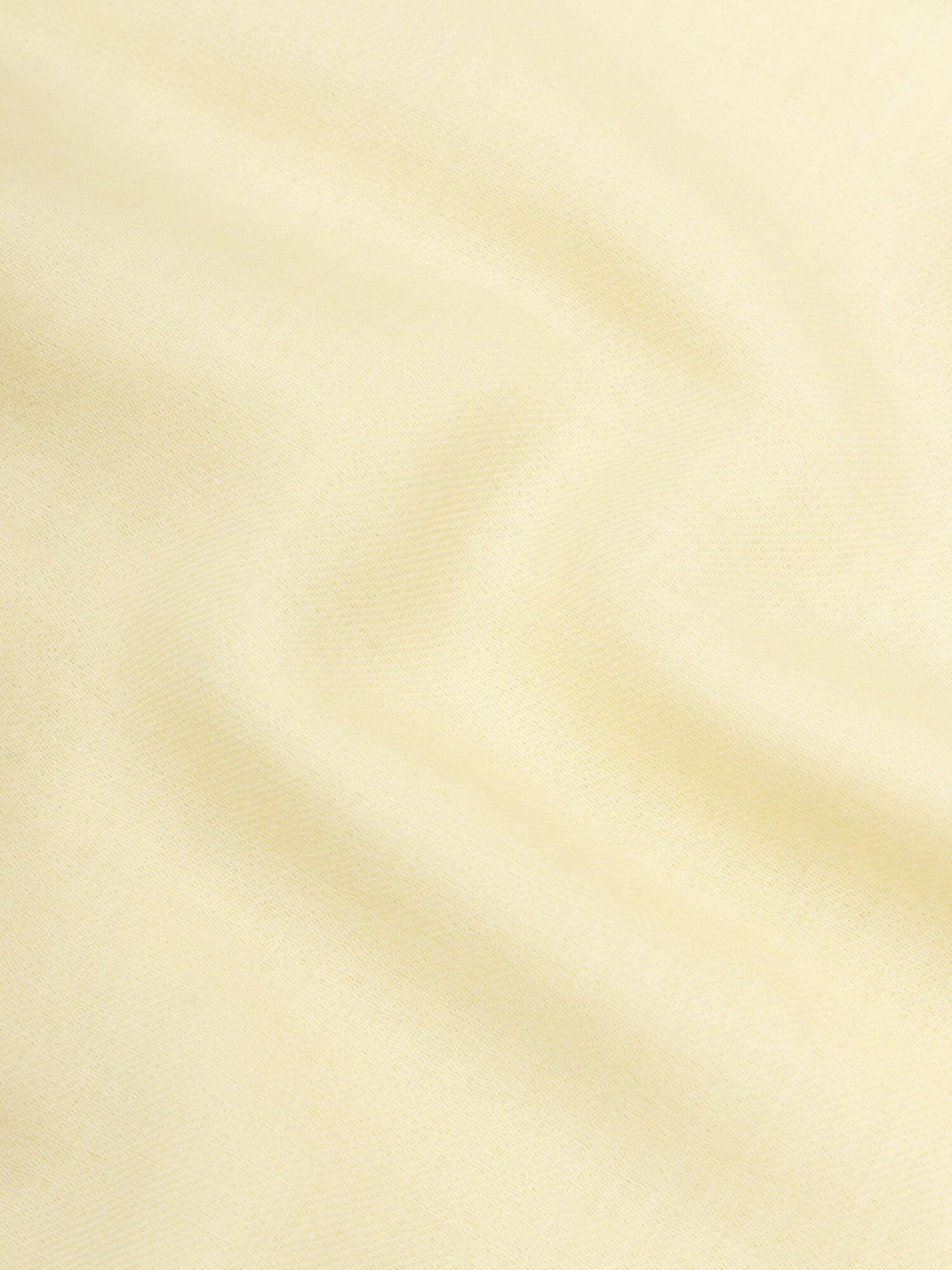 close up of a light yellow lightweight cashmere scarf