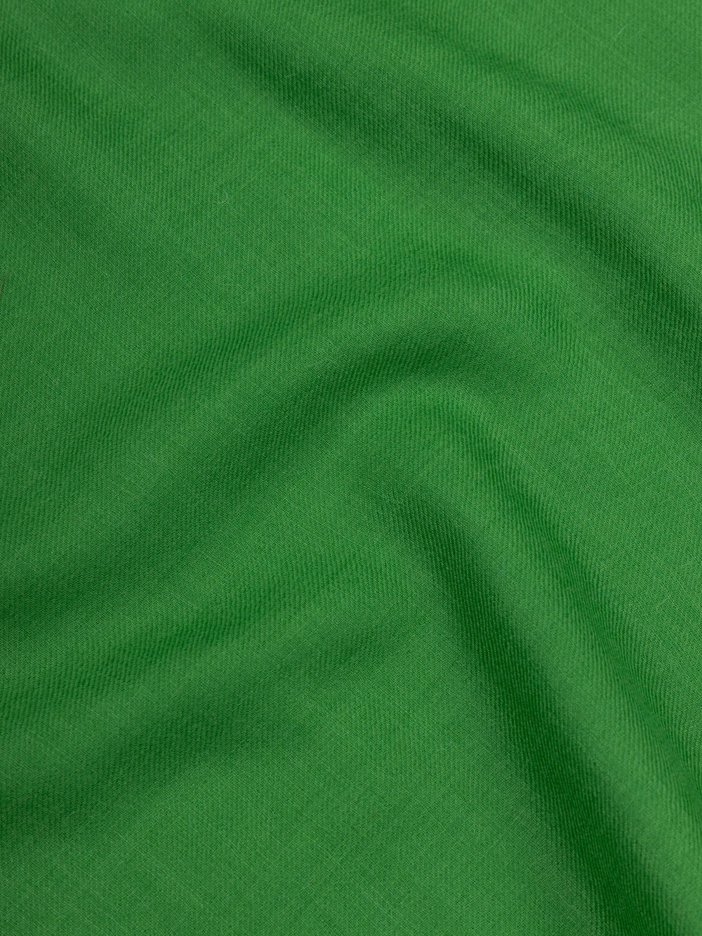 close up of a lightweight green cashmere scarf