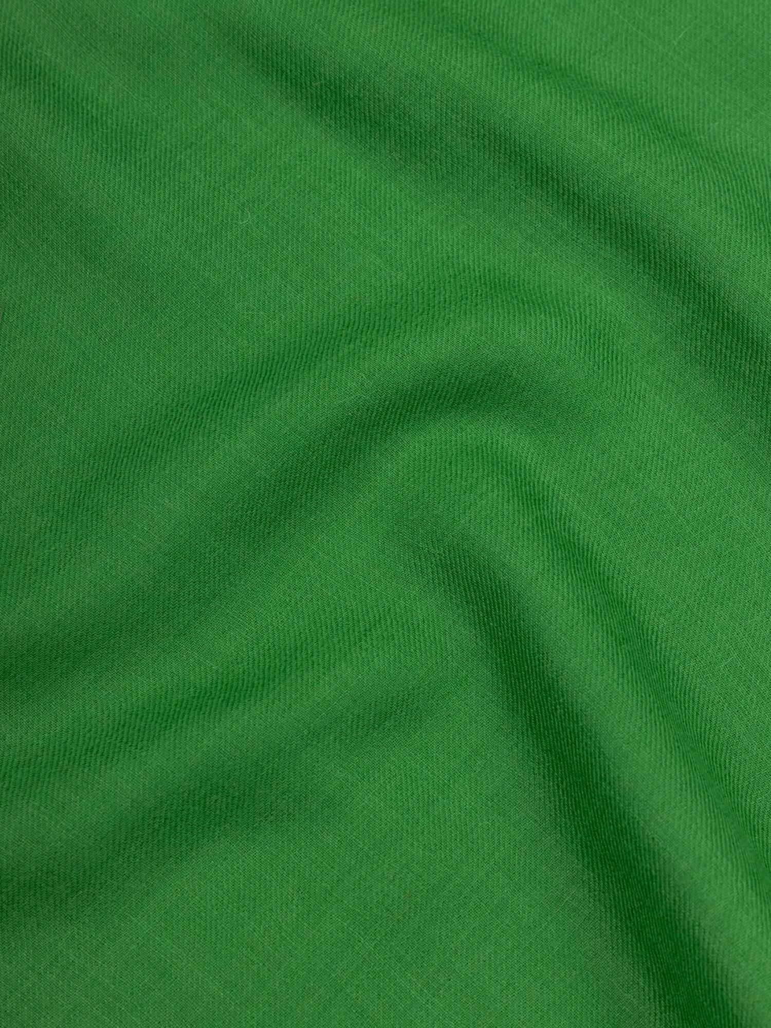 close up of a lightweight green cashmere scarf