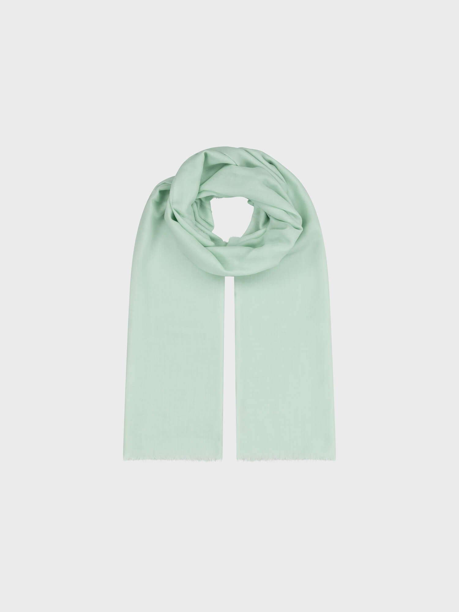 lightweight mint green cashmere scarf on a grey background