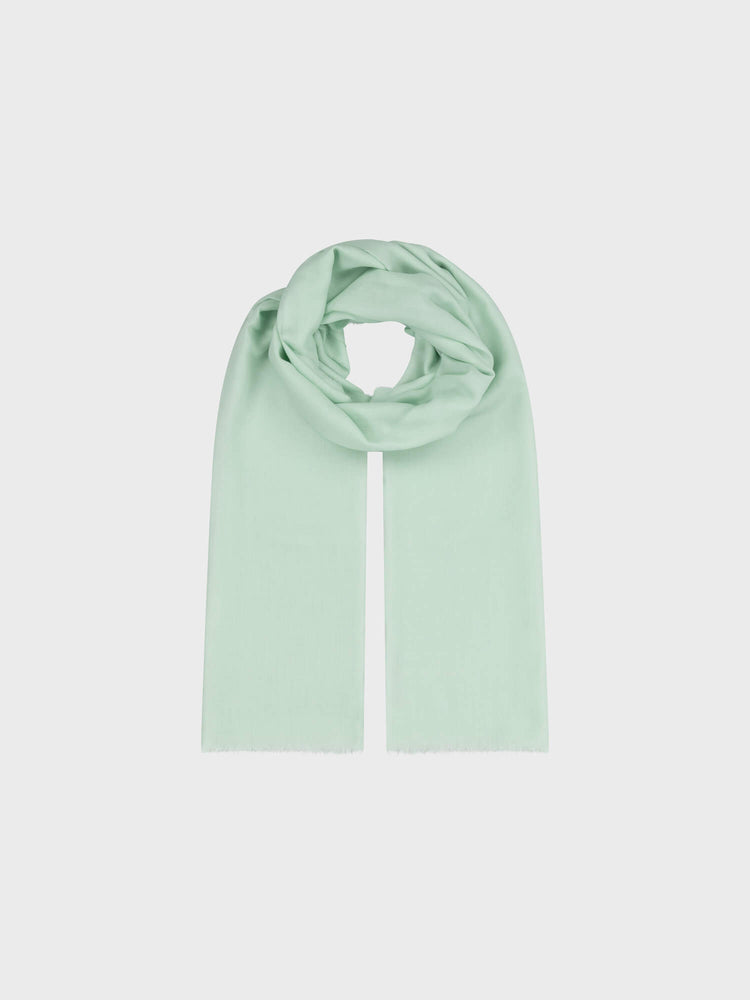 lightweight mint green cashmere scarf on a grey background