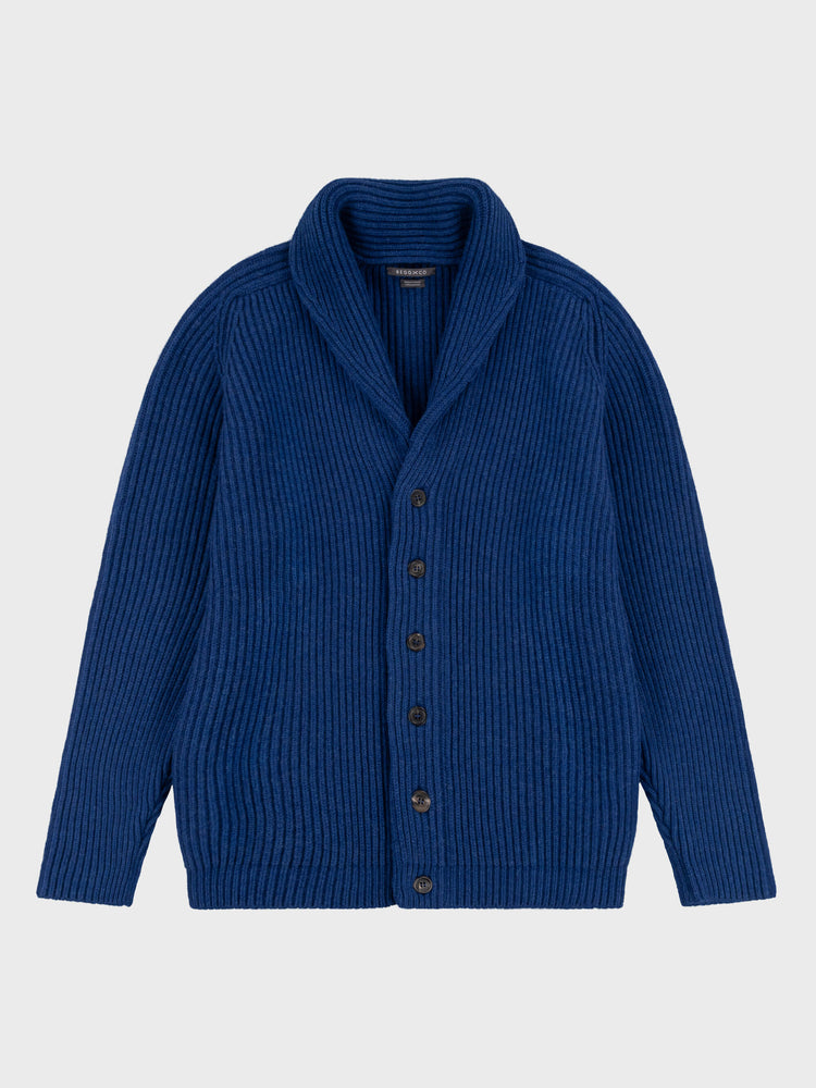 chunky ribbed blue cashmere shawl collar cardigan on a grey background