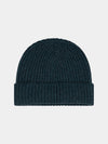 Dark green cashmere knit beanie on a light gray background