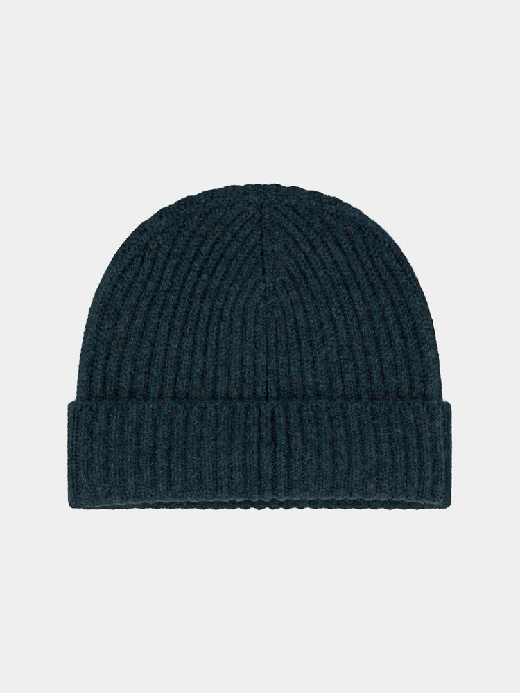 Dark green cashmere knit beanie on a light gray background