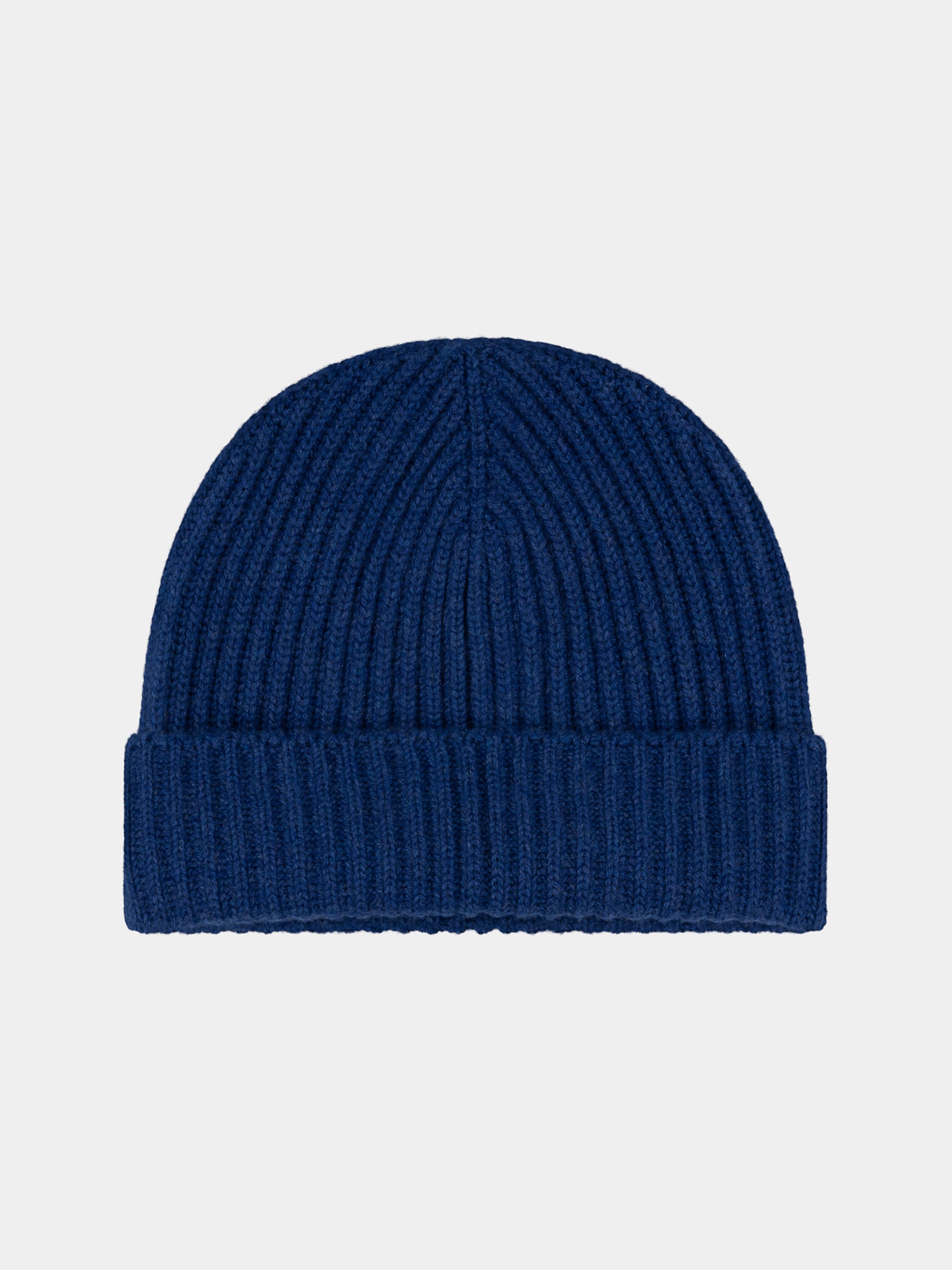 Blue knit cashmere beanie on a light gray background