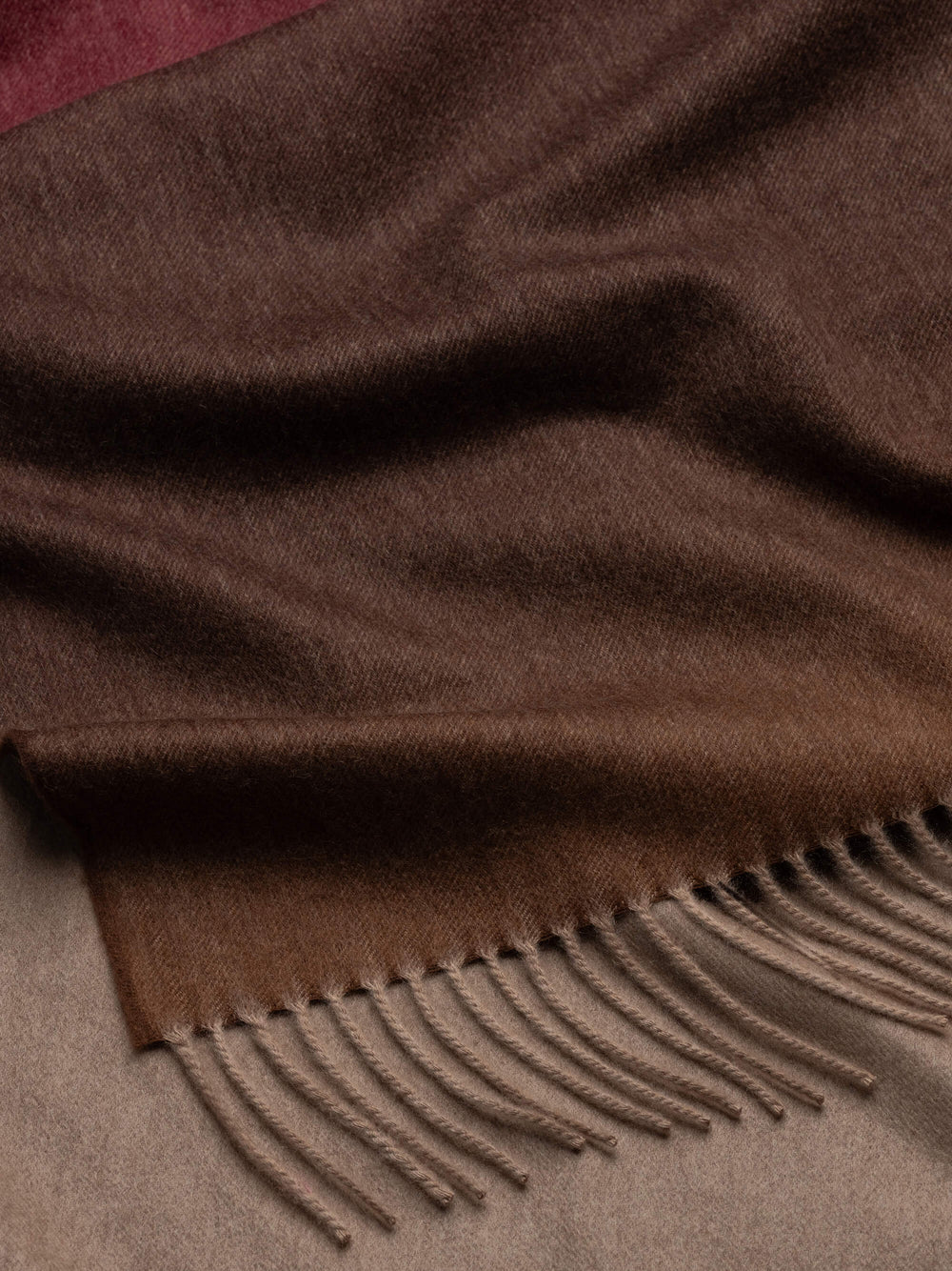 detail of ombre gradient cashmere throw and fringe detail