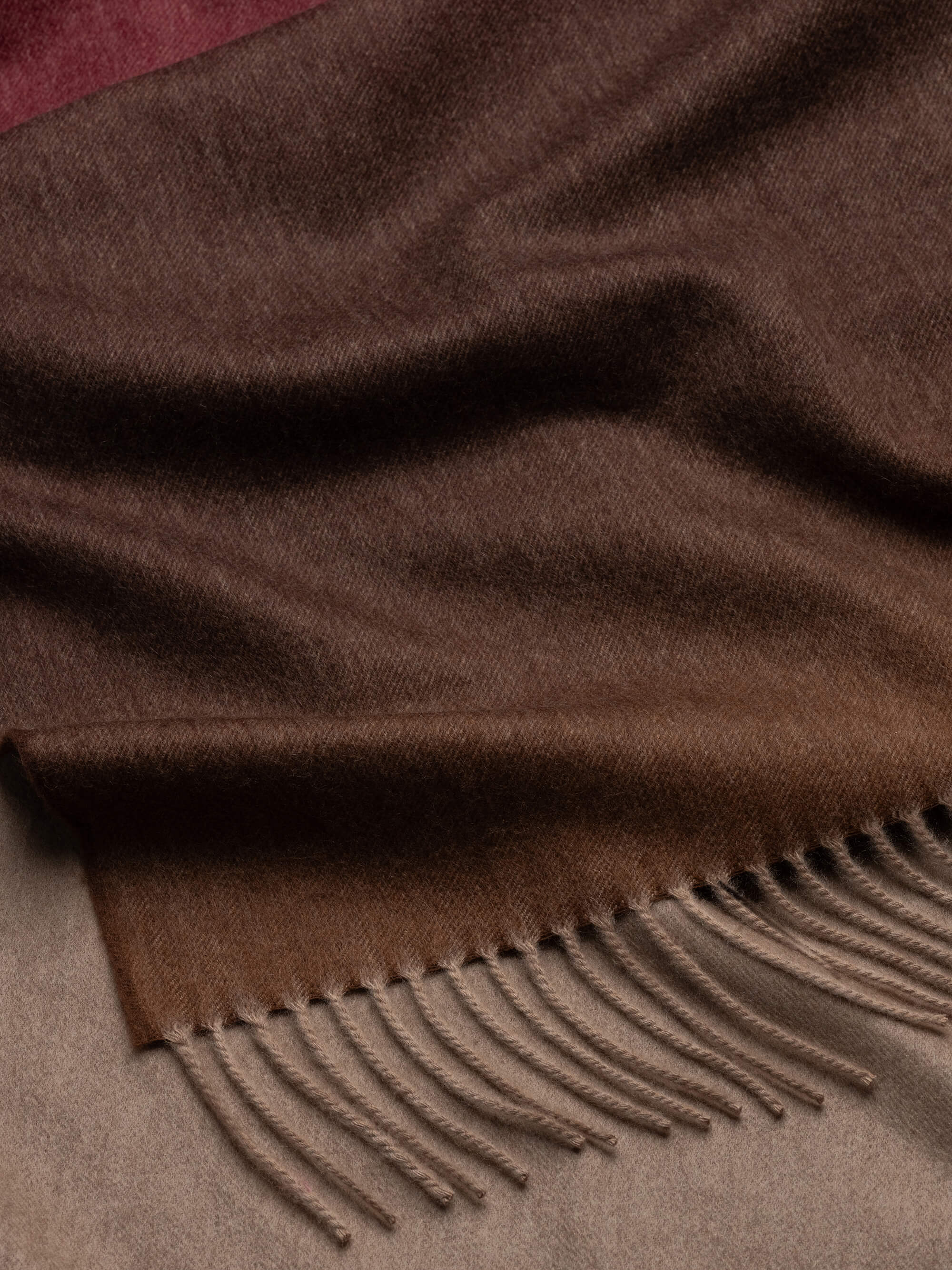 detail of ombre gradient cashmere throw and fringe detail