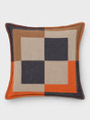 A checkered cushion with a contemporary design, featuring a blend of colors including beige, black, orange, and gray, with visible contrast stitching.