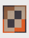 A checkered blanket with a modern design, featuring blocks of colors such as orange, beige, and brown, with contrasting stitching.