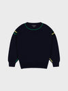 Black sweater with green and yellow accents on a light gray background