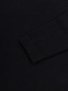sleeve detail of black lightweight cashmere roll neck sweater