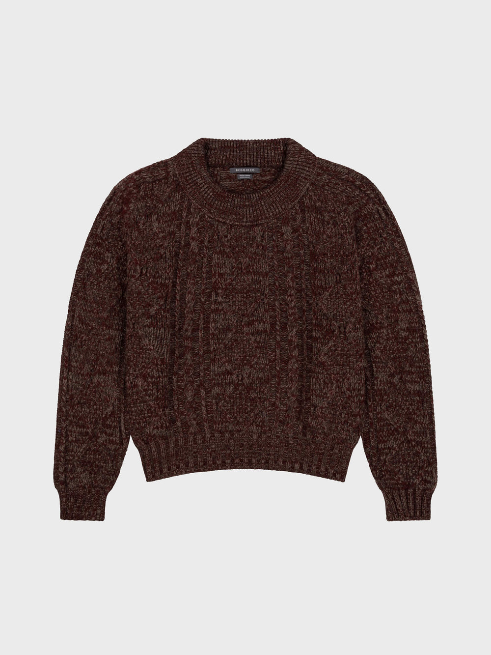 Brown and red knitted sweater on a light gray background