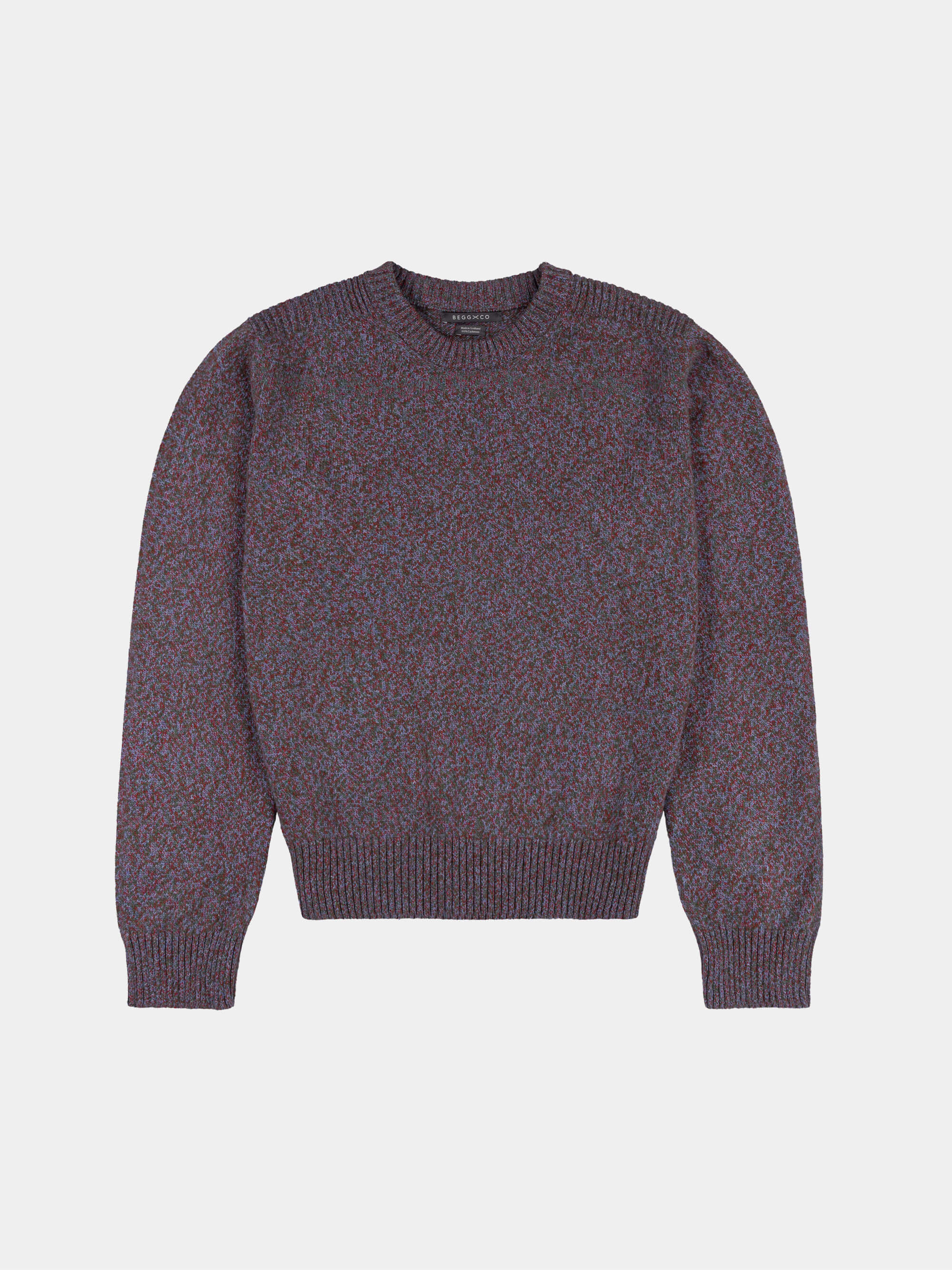 Purple cashmere sweater on a light gray background