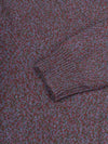 Close-up of a purple cashmere sweater with a patterned design.