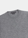 Gray cashmere sweater with on a light gray background