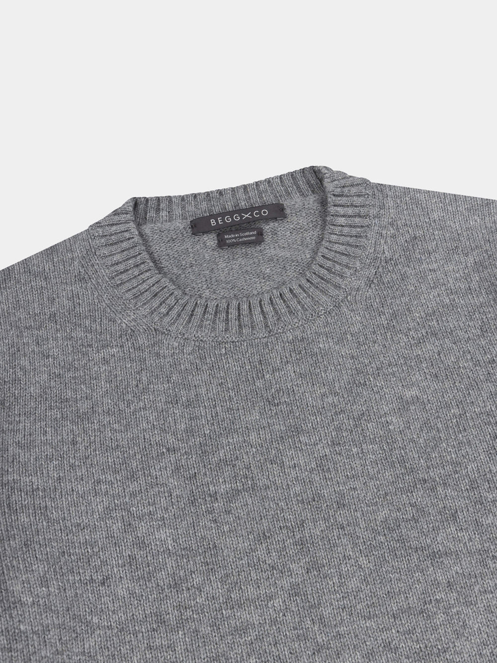 Gray cashmere sweater with on a light gray background