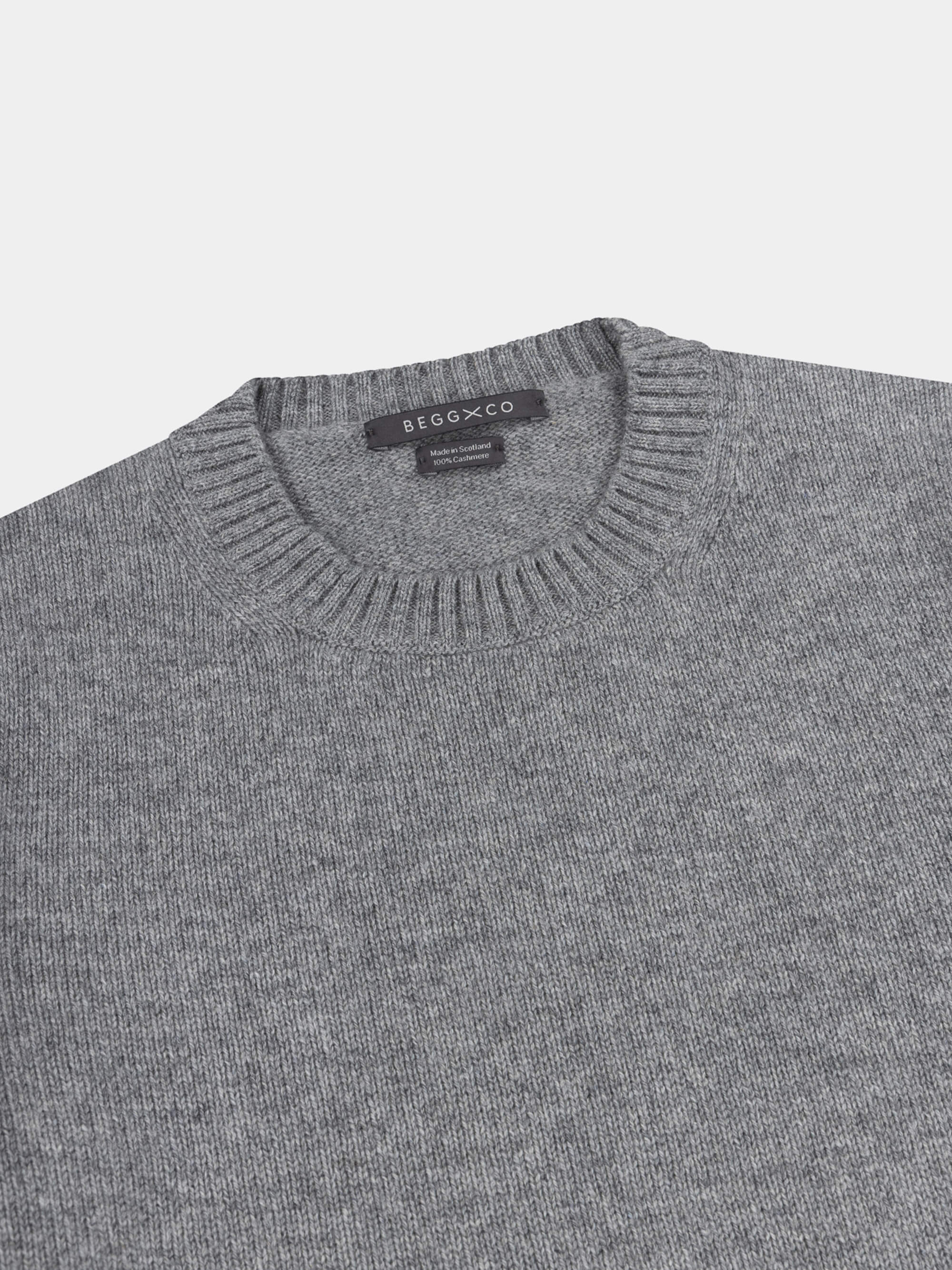 Gray cashmere sweater with on a light gray background