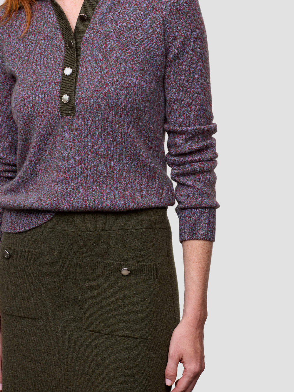 close up of woman wearing green cashmere skirt