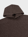 Brown knitted sweater with a hood on a light gray background